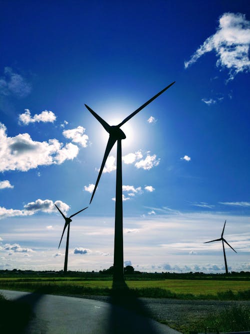Silhouette Photo of Wind Turbines