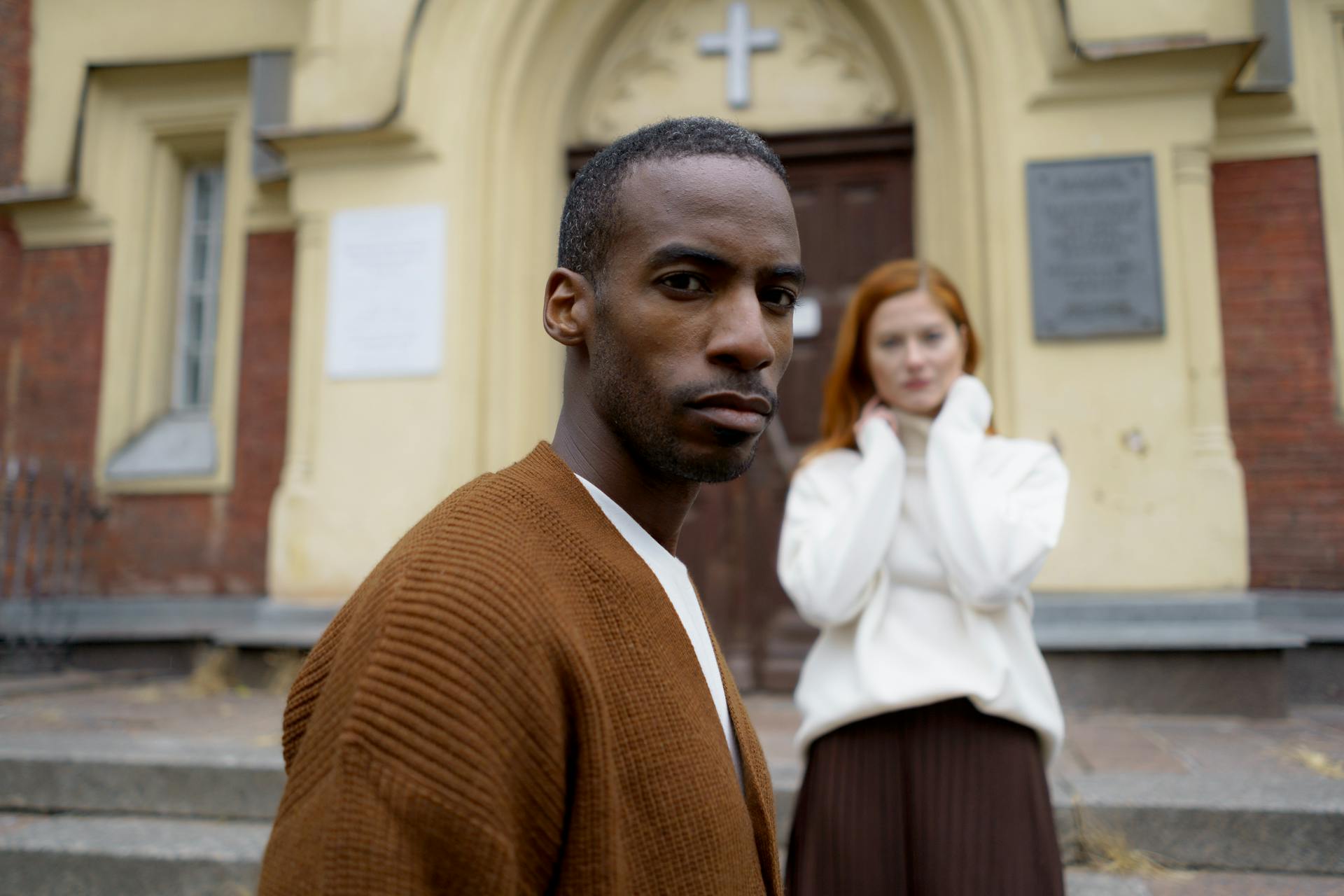 Shallow Focus Photo of a Man Wearing a Brown Cardigan