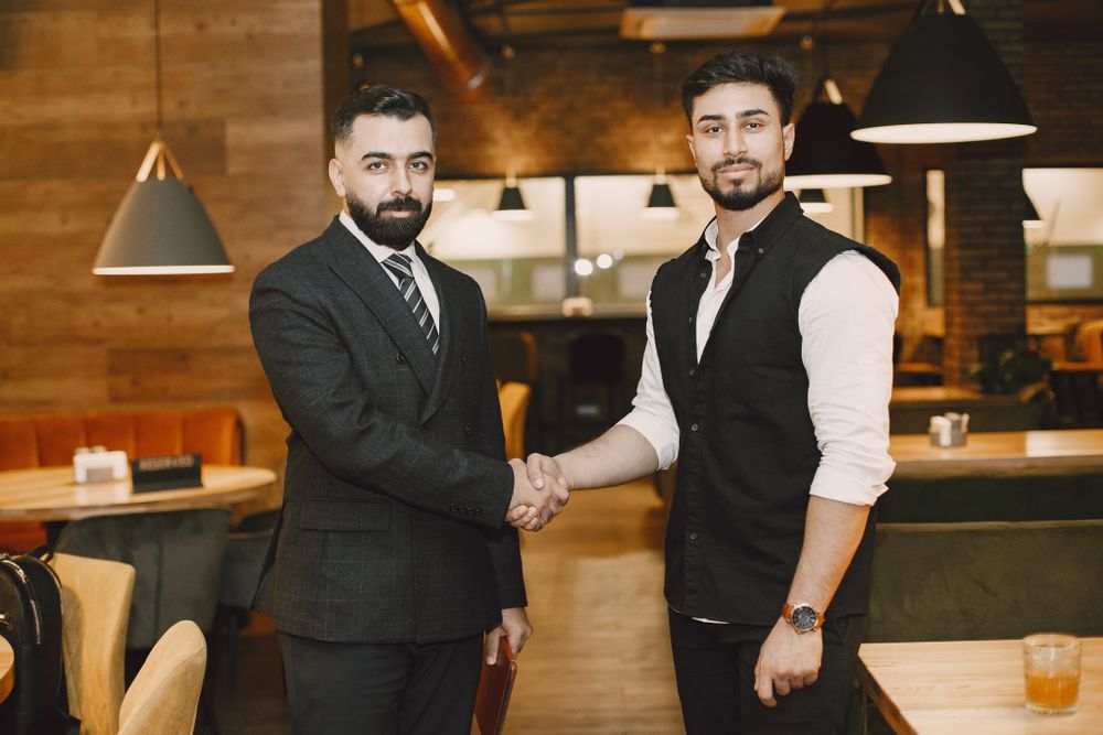 Business partners shaking hands in agreement