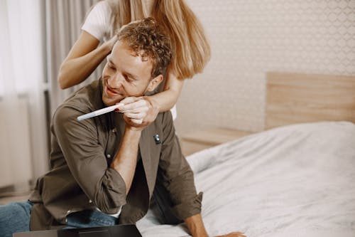 Woman Showing Pregnancy Test to a Man
