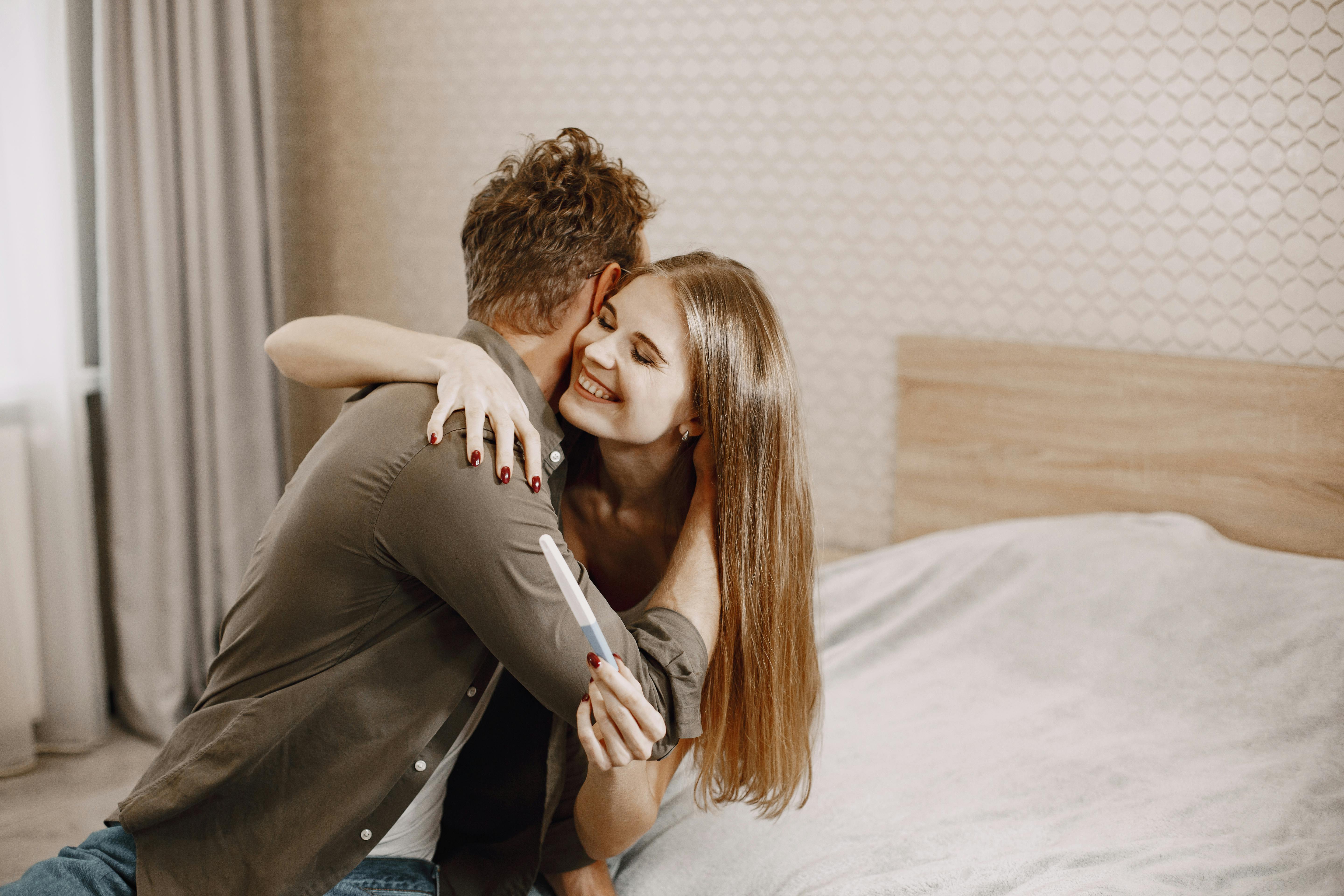 Couple Hugging on the Bed · Free Stock Photo