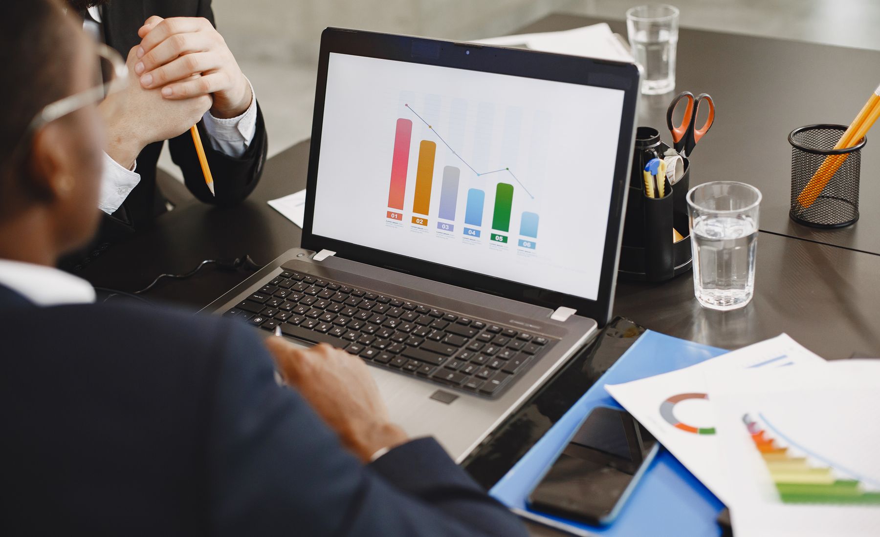 Professionals reviewing business analytics