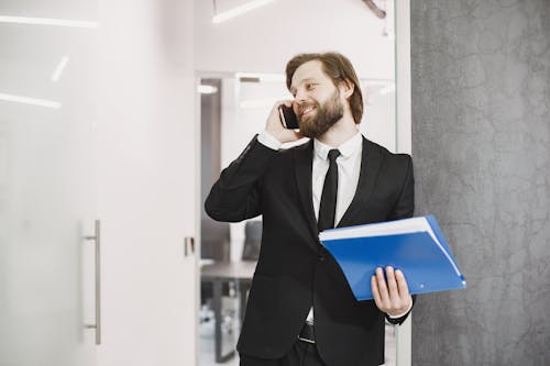 Smiling Businessman Talking on a Phone 