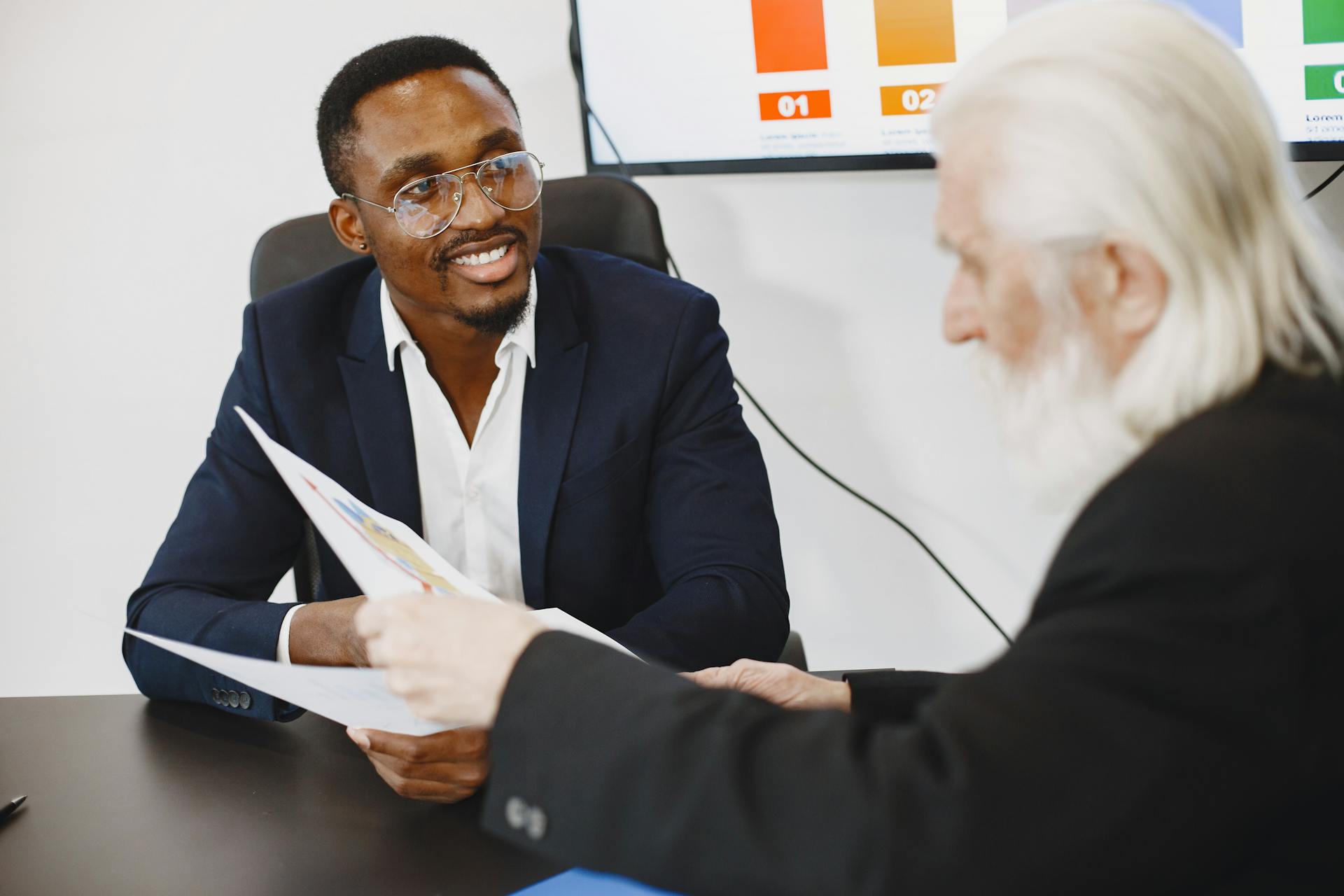 An Elderly Man Holding Documents