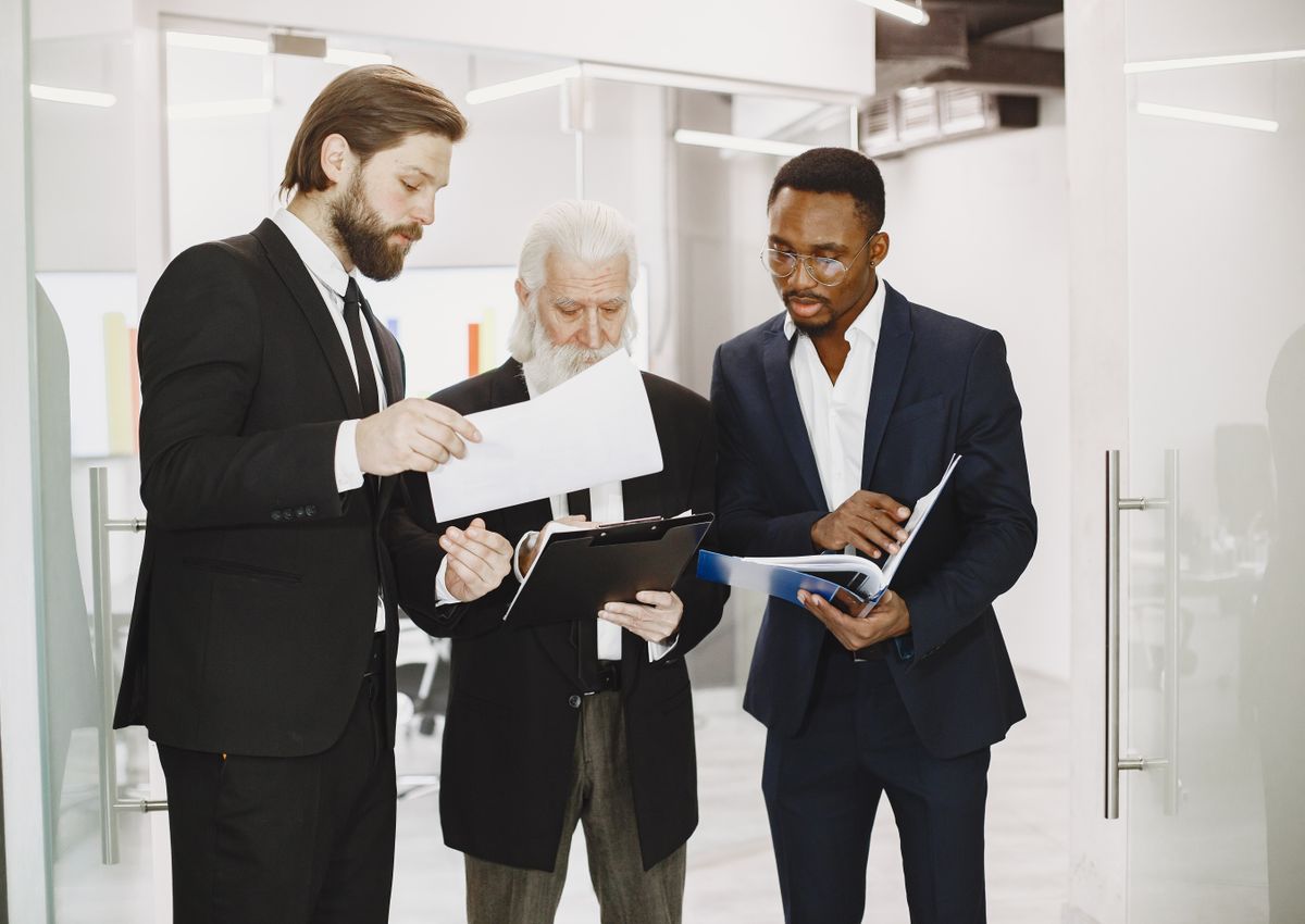 Professionals reviewing corporate documents for PRO services
