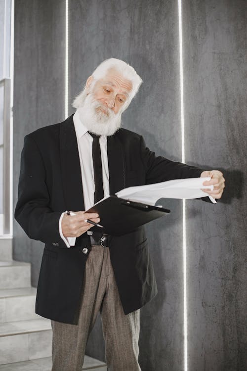 Man in Suit with Documents