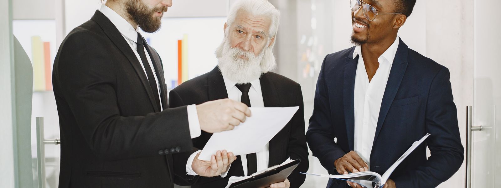 Business professionals discussing documents in an office