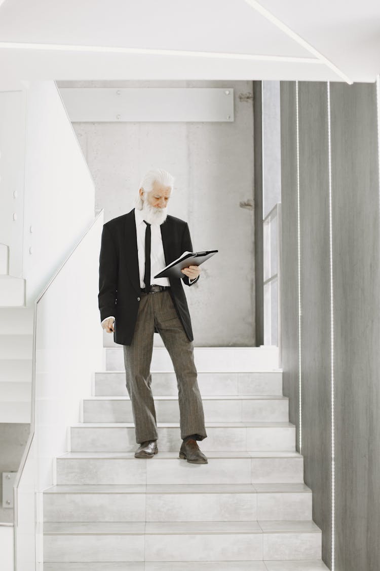 Businessman Walking Down Stairs