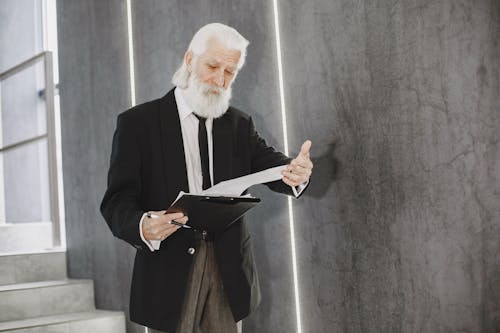 Senior Businessman Looking at Documents 