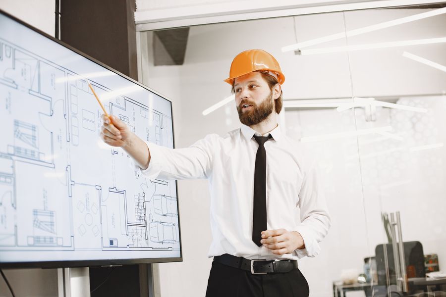 Architect presenting building blueprints