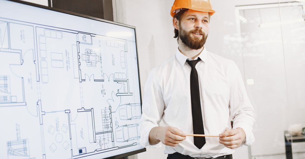 Architect presenting building blueprints and product specifications in a modern office