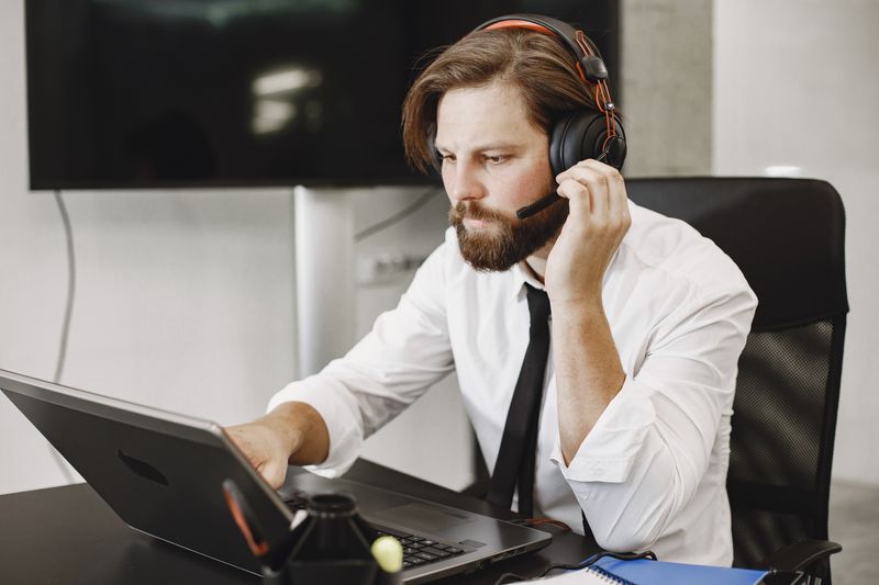 A support agent on a headset call — photo by Gustavo Fring on Pexels