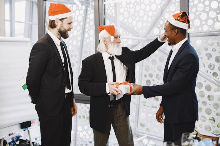 Businessmen Exchanging Christmas Gifts