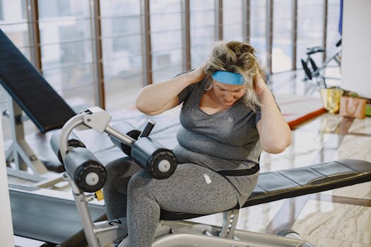 A woman working out on gym equipment, promoting fitness and a healthy lifestyle.