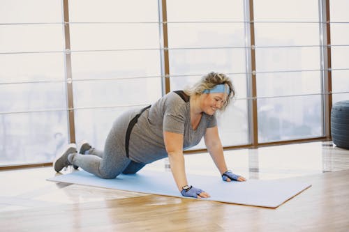 Woman Doing Yoga on a Mat 