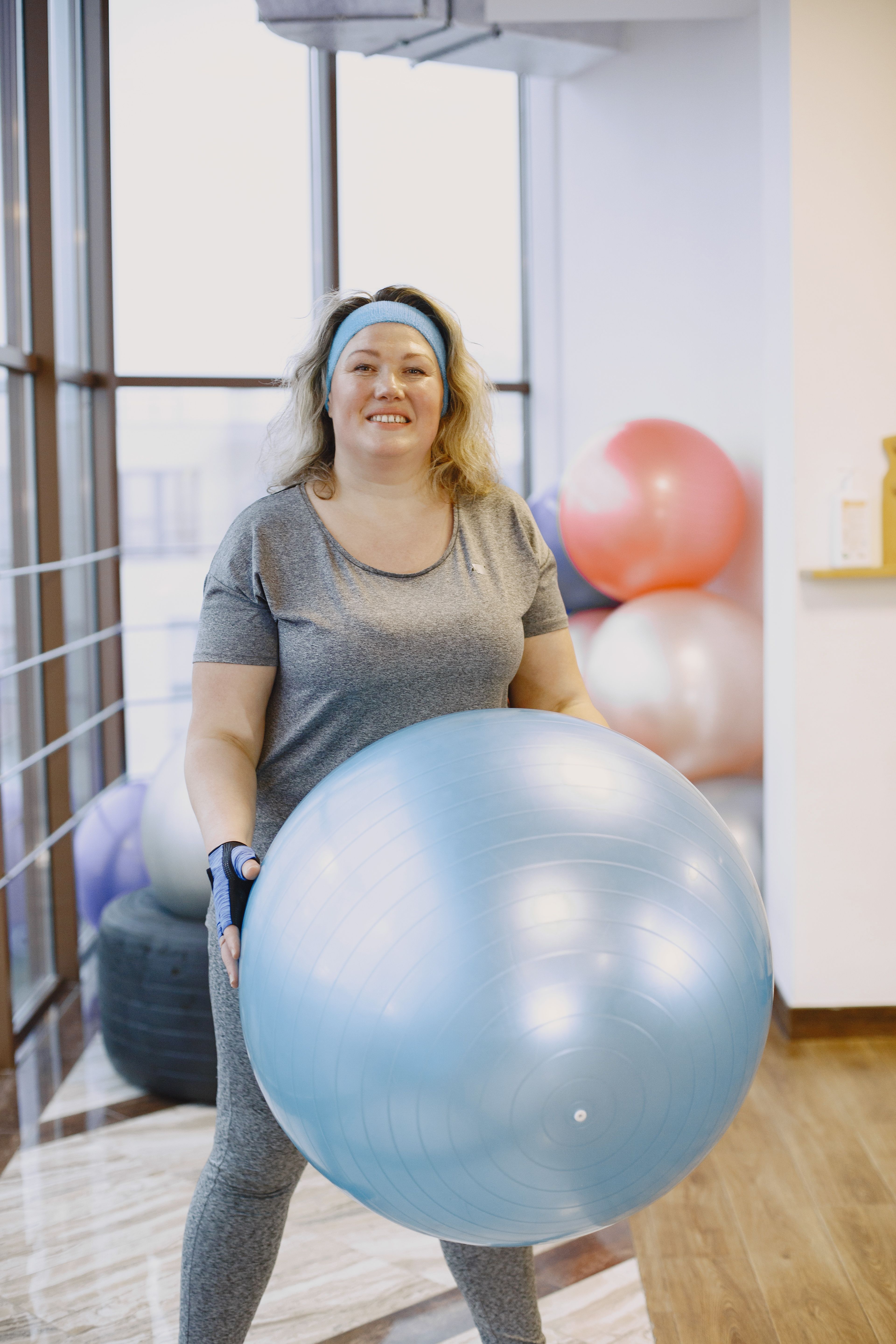 Woman holding a Exercise Ball · Free Stock Photo
