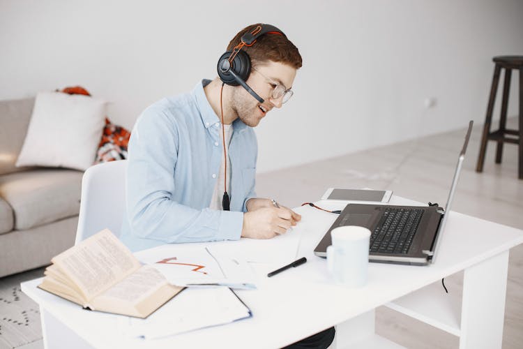 Man Working At Desk At Home