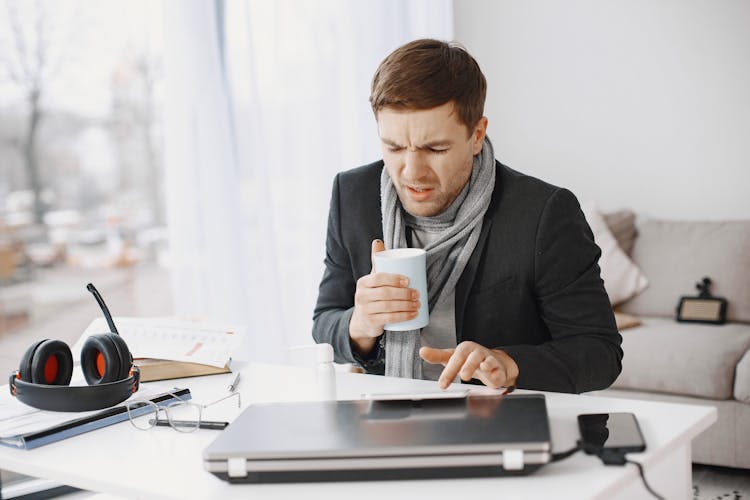 Ill Businessman Working At Home