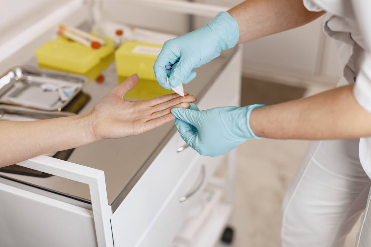 Nurse performing a blood test procedure on a patient