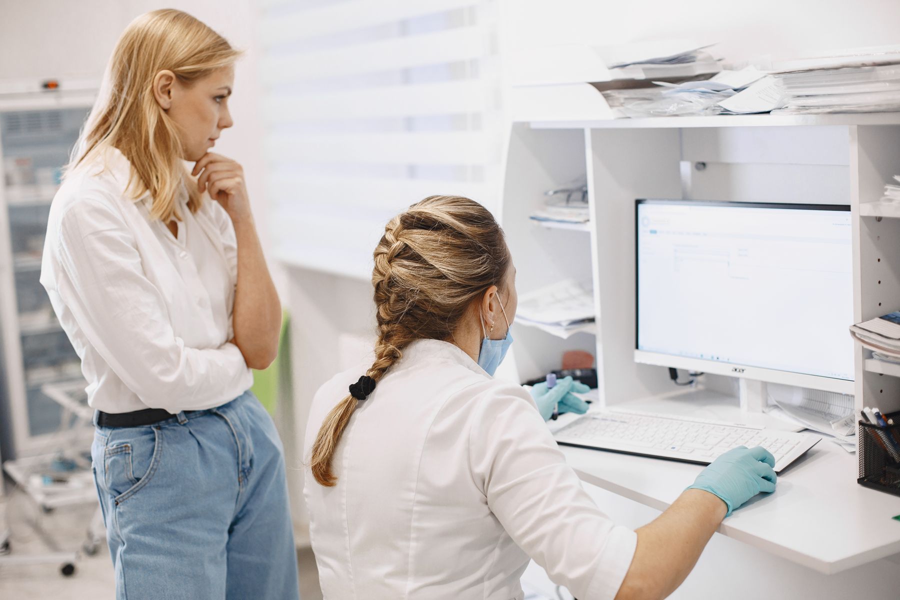 Healthcare professionals reviewing information on a clinical computer