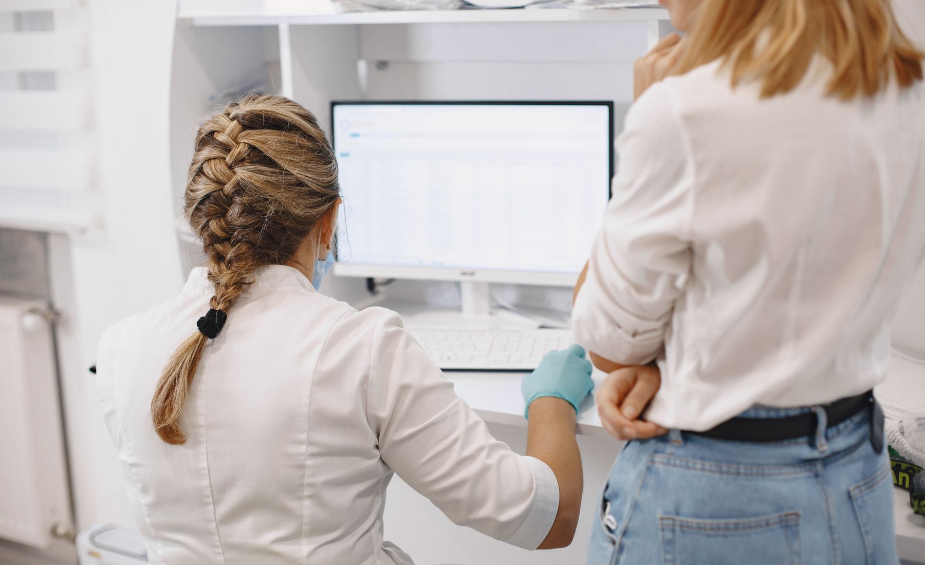 Healthcare professionals working with digital records