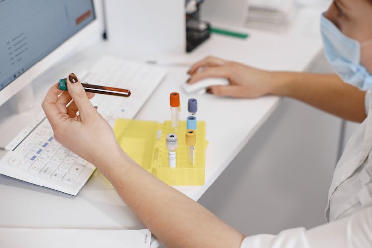 Nurse Labeling Test Tubes 