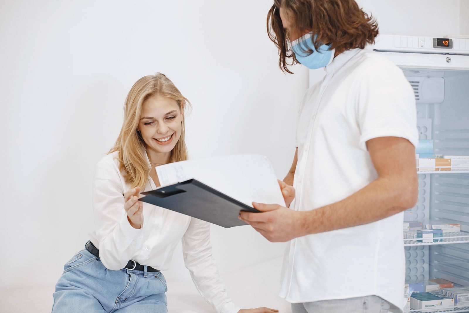 Doctor reviewing cholesterol test results with a patient in Dallas