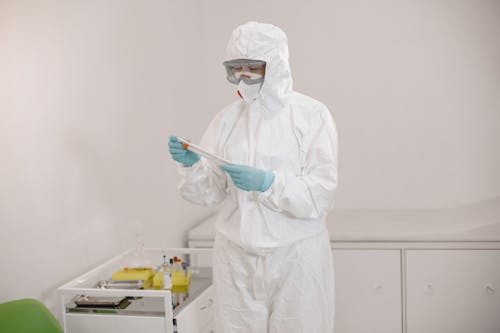 Nurse Wearing Clean Suit in a Laboratory 