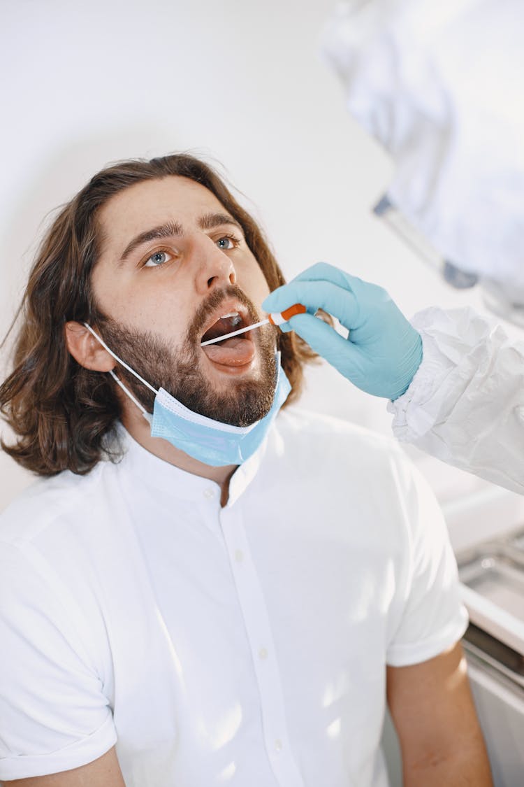 A Man Getting A Swab Test