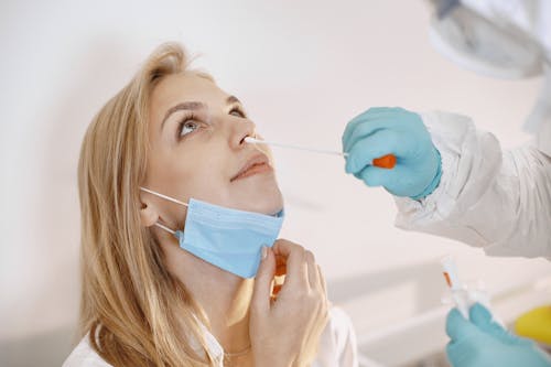 A Woman Getting a Nasal Swab Test