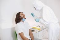 Healthcare Worker Collecting Specimen Sample from a Man
