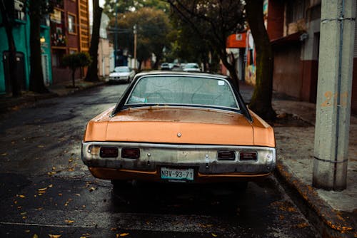 Orange Classic Car Parked on Roadside