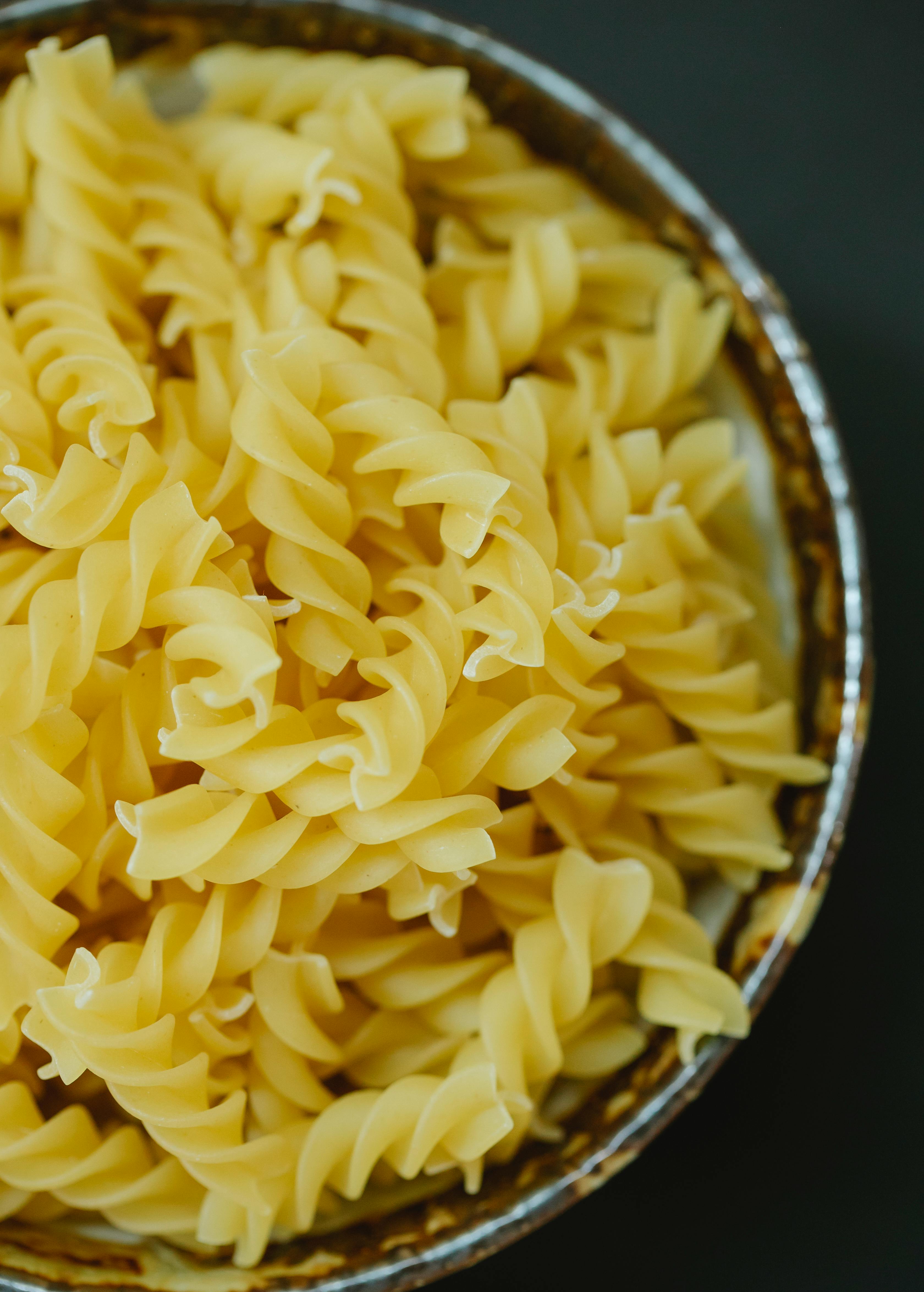 twirl pasta in bowl on table