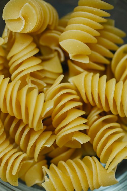 Free From above of traditional dried uncooked Italian pasta fusilli made with egg dough Stock Photo