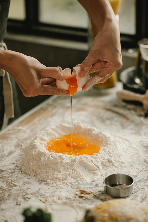 Free Woman making dough in kitchen Stock Photo
