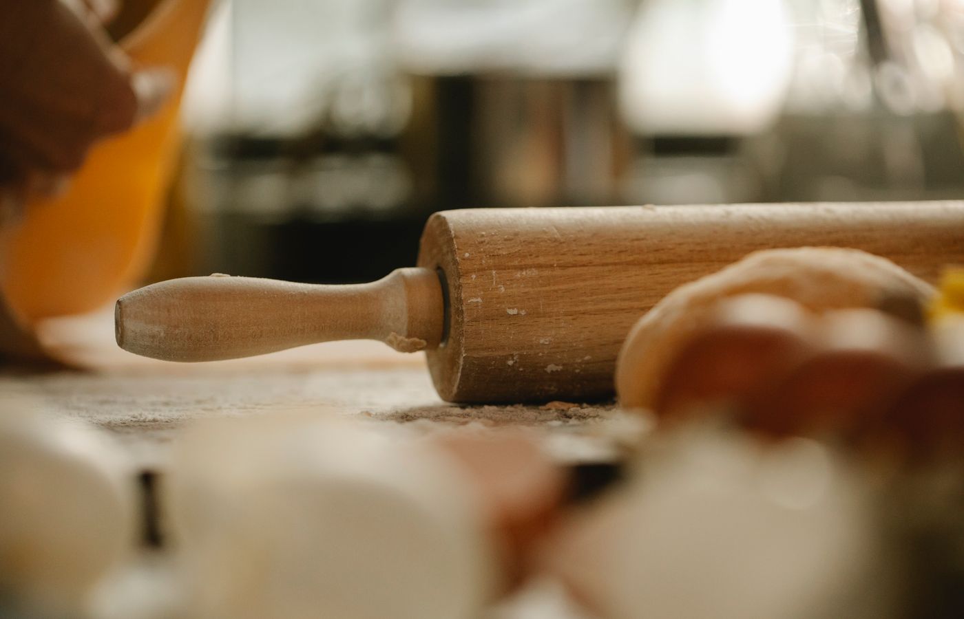 A cozy kitchen setting featuring a wooden rolling pin and ingredients, ideal for culinary themes.