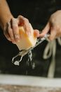 Crop unrecognizable chef grating cheese in kitchen