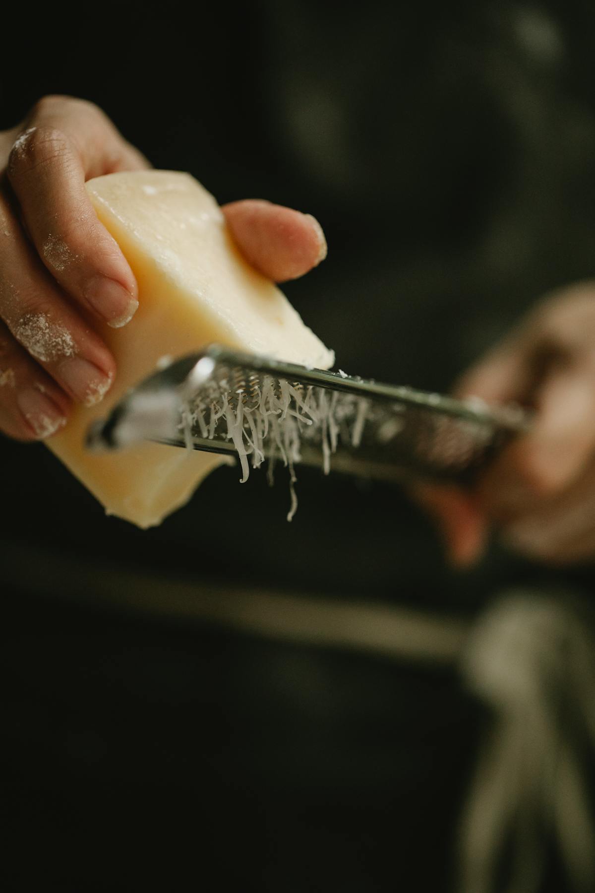 Chef preparing a plated dish in a professional kitchen