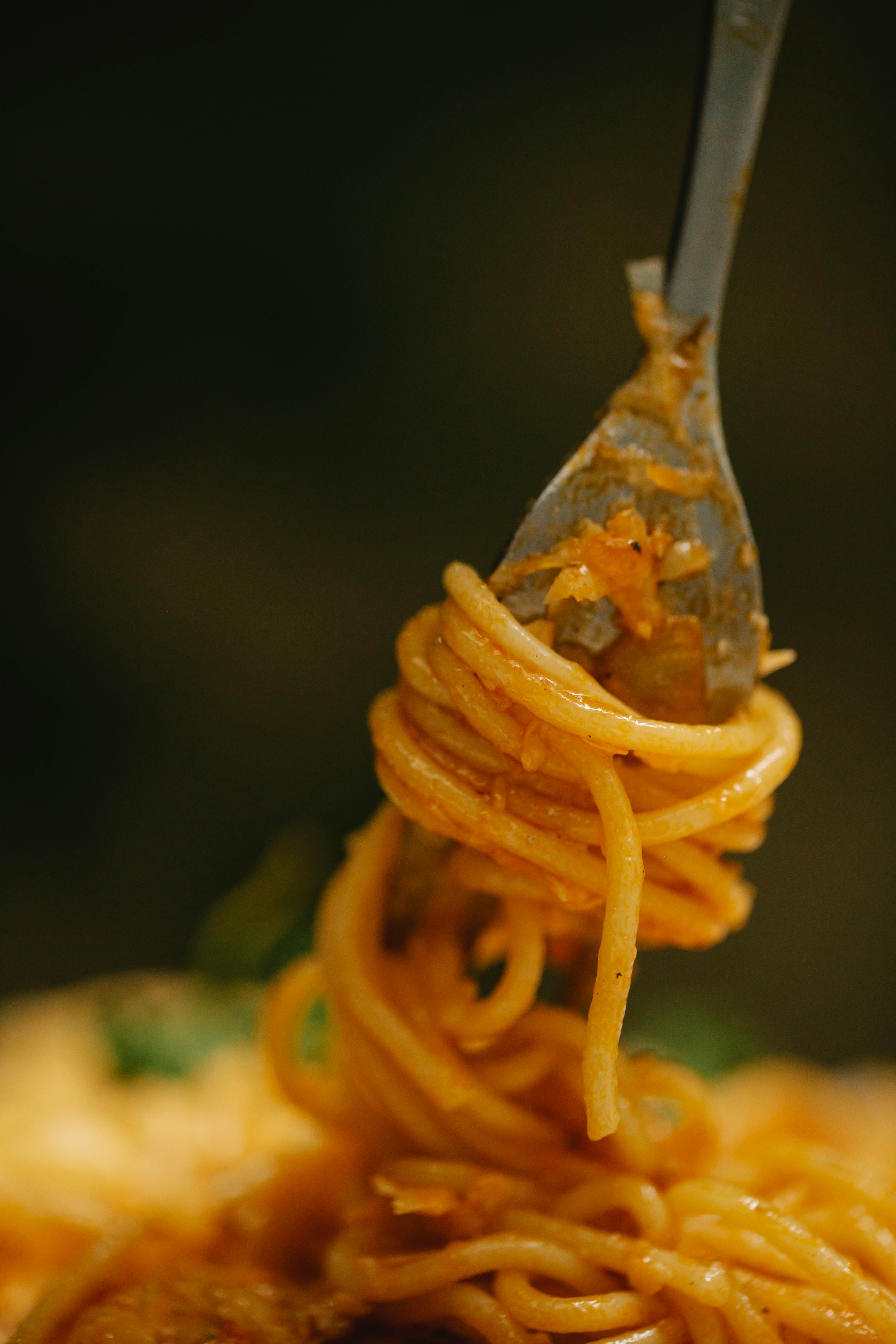 yummy pasta bolognese on fork