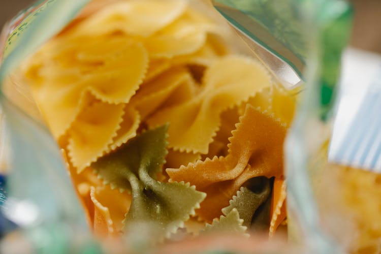 Pack Of Dry Raw Farfalle Pasta Placed On Table