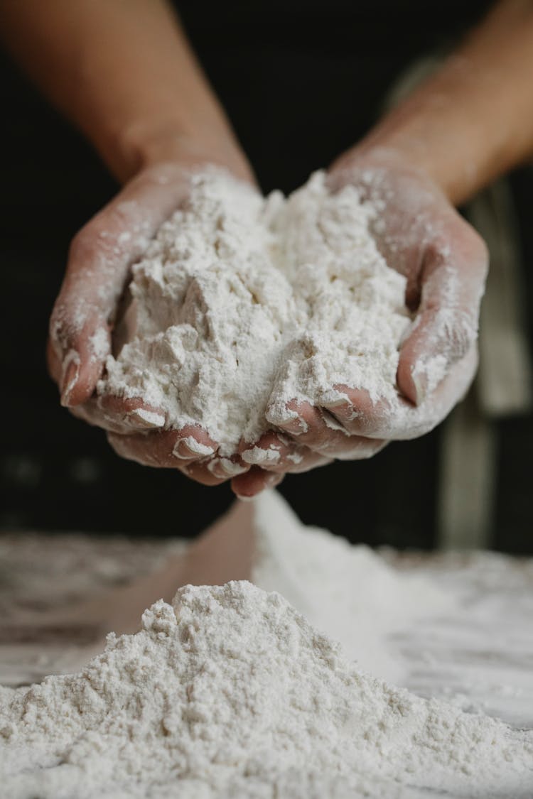 Woman Showing Wheat Flour In Hands