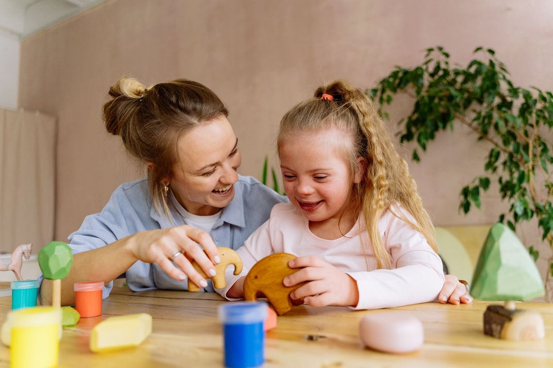 Mother and daughter enjoying a colorful learning toy activity together