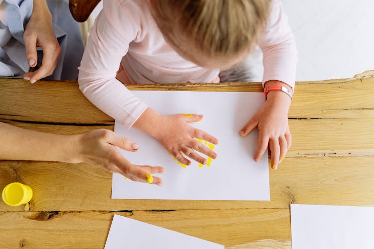 Overhead Shot Of A Girl Doing Painting 