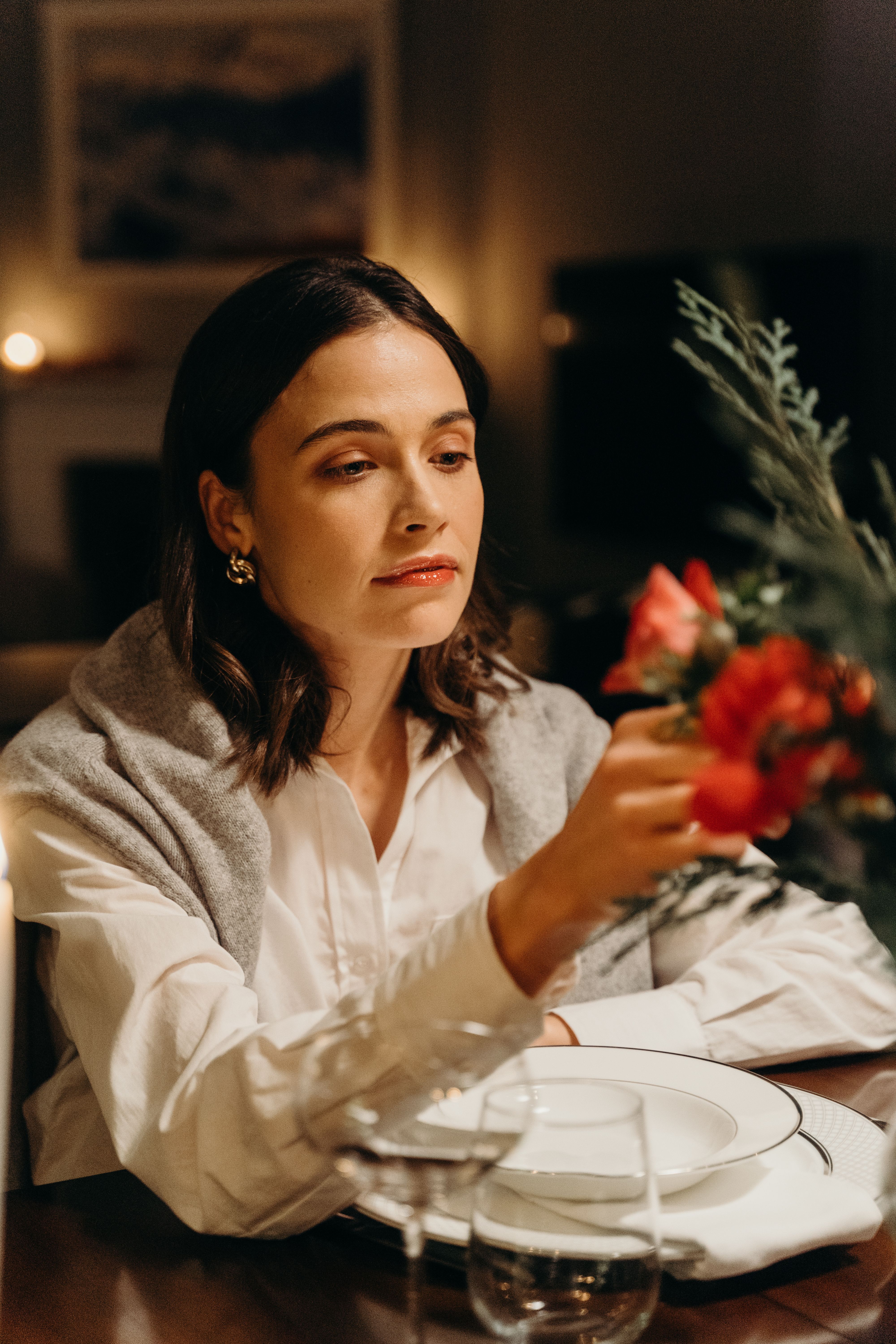 A Woman Sitting at the Table · Free Stock Photo