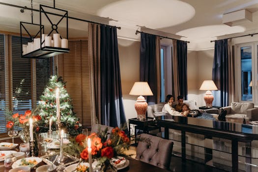 Family enjoying Christmas evening together in a beautifully decorated living room.