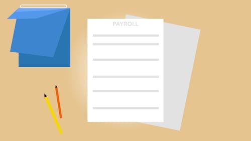 Payroll documents and calendar arranged on table with pencils