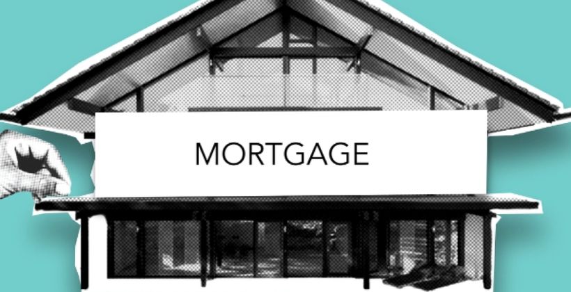 Cutout paper house representing a mortgage loan concept with financial documents in background