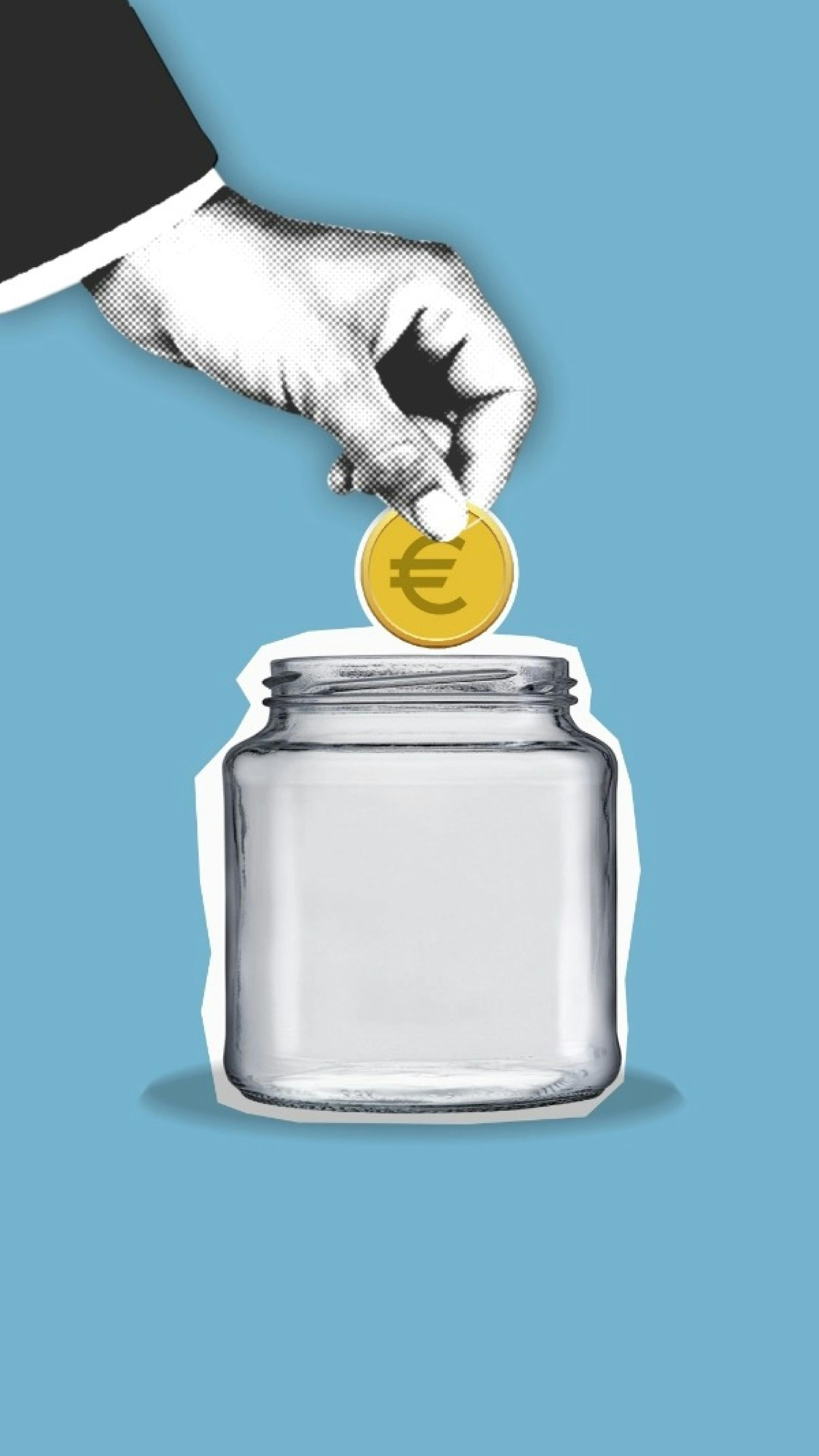 crop faceless person putting coin into glass jar