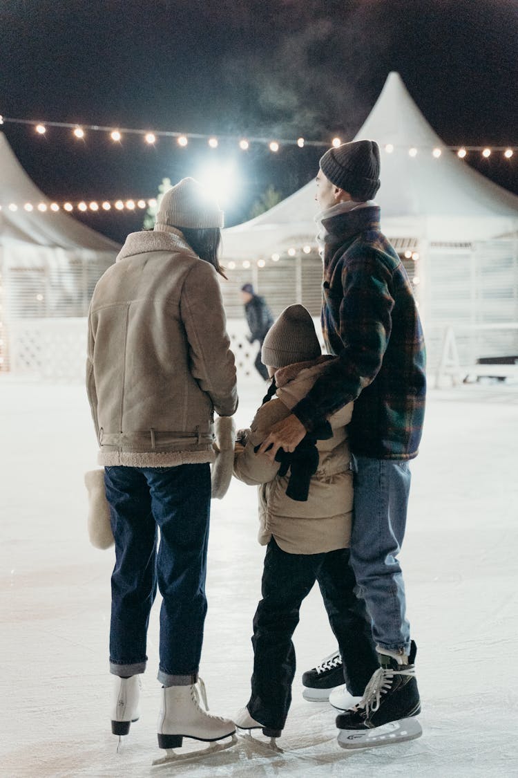 A Family Doing Ice Skating 