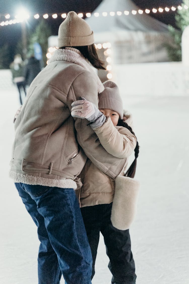 Woman Hugging Her Daughter